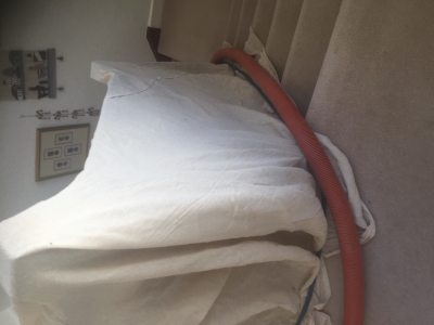 Dust sheets covering a banister.